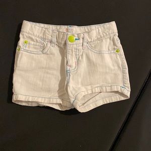 children's white jean shorts with blue and pink stitching plus green buttons